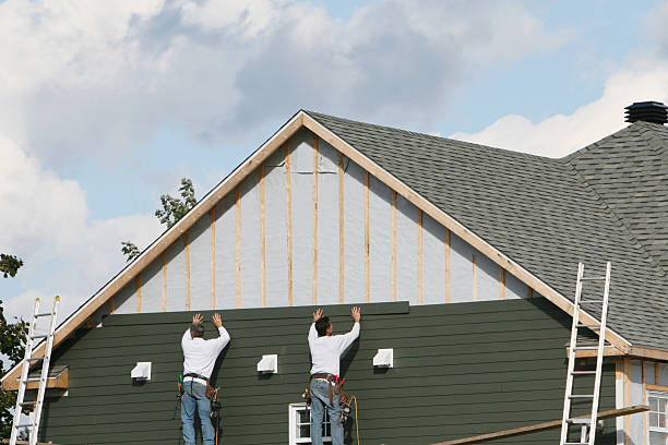 Professional Storm Damage Siding Repair technician working in Delaware, OH